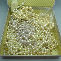 A collection of faux pearl necklaces and bracelets
