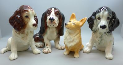 Four porcelain Sylvac dog figures, 12cm h