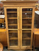 A Victorian pine two door bookcase