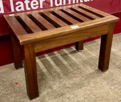 A teak luggage rack