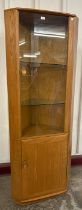 An Ercol Blonde ash model 3856 Windsor corner cabinet