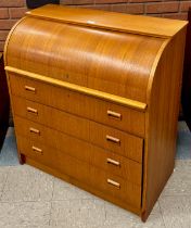 A teak cylinder top bureau