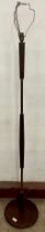 A teak standard lamp. This is being sold as antique/vintage for its historical/decorative purposes