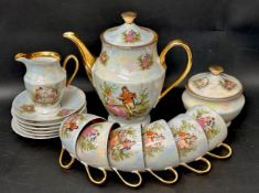 A European, possibly Polish, iridescent lustre coffee set, consisting of coffee pot, six cups and