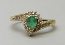 A 14k gold, emerald and diamond cluster ring, 2.6g, N
