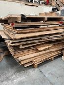 A large quantity of assorted timber boards, offcuts and related items.