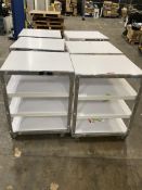 Six pre-owned four tier metal shop shelves on wheels.