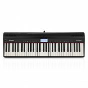 A boxed as new Roland Go:Piano, 61 key digital piano, black (stock image).