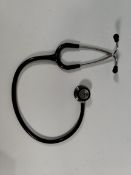A pre-owned Littmann Classic III stethoscope in black.