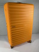 A boxed as new American Tourister FastForward 78cm Spinner 78/29 suitcase in Radiant Orange.