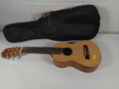 A pre-owned Yamaha guitalele GL1 includes travel case.