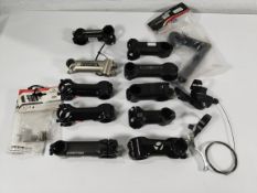 Assorted bicycle parts to include Bontrager stems, Tifosi handlebars and pedals.
