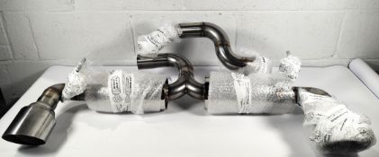 A R.S Sport performance twin muffler system for car, fitment unknown (41042).