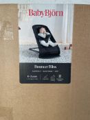 A Baby Bjorn Bouncer Bliss, black mesh.