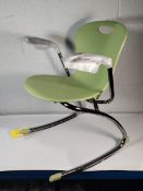 An as new Zuma Rocker chair with arms, Colour: Apple.