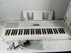 A Yamaha EZ-310 Keyboard.