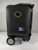 A pre-owned Airwheel Robot SE3S Smart ride on suitcase with charger and battery.