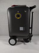 A pre-owned Airwheel Robot SE3S Smart ride on suitcase with charger and battery.