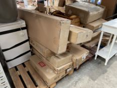 Assorted flatpack furniture and household items.