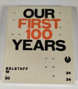 An as new Belstaff 'Our First 100 Years' book by Harper Collins Publishers.
