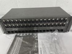 A pre-owned Behringer S32 Stagebox with some minor damage.