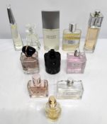 Forty four perfumes/testers and related to include Armani, YSL, Dior, Prada and Estee Lauder (please