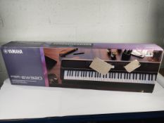 An as new Yamaha portable keyboard (PSR EW320).