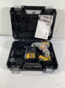 An as new Dewalt 18v brushless compact combi drill with a battery and charger.