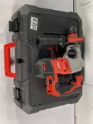 A pre-owned Milwaukee hammer drill with case (unit only).