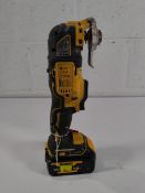 A pre-owned DeWalt DCS355 18v multi tool with battery.