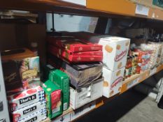 A shelf of assorted in-date food and confectionery products and related.