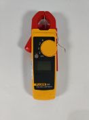 A pre-owned Fluke 323 Clamp Meter (unit only).