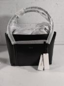 A Calvin Klein Linn medium handbag with tags.