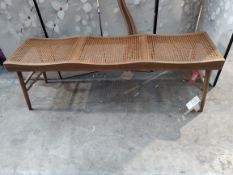 An as new Zara home wood and rattan bench 47 x140 x 39cm (brown).