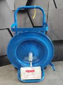 A pre-owned strap dispenser trolley in blue and a pallet strapping tensioner ratchet.
