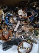 A quantity of assorted costume jewellery and watches to include Guess, Michael Kors and related.