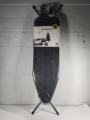 An as new Brabantia Ironing Board B, 124 x 38 cm with steam iron rest, denim black.