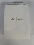 An as new Wolford x Adidas sheer motion body in nearly black/black (Size M).