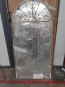 An as new Somerley gothic arch stone coloured garden mirror 140cm x 65cm.