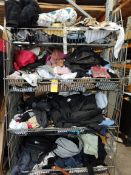 A large quantity of assorted as new and pre-owned clothing in four baskets.