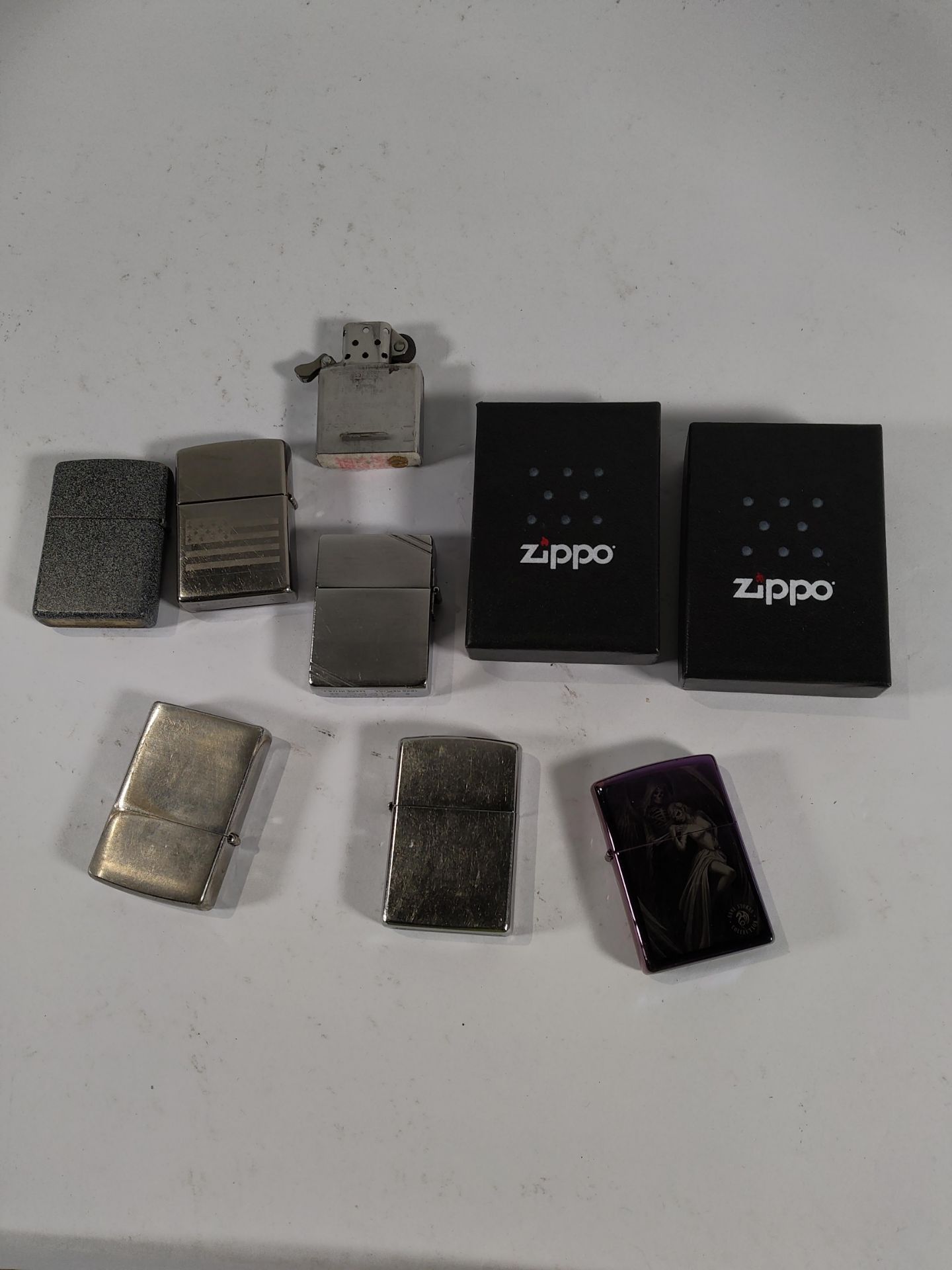 Eight pre-owned Zippo lighters (over 18s only).