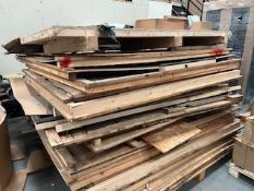 A large quantity of assorted timber boards, offcuts and related items.