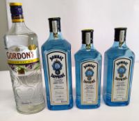 Three Bombay Sapphire dry gins 1 x 1L, 2 x 700ml and one Gordons dry gin 1L.