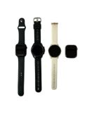 Two pre-owned Garmin Smartwatches (untested) & two pre-owned Apple Watches (iCloud locked, sold for