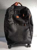 A pre-owned Bric's 77cm lightweight spinner suitcase.