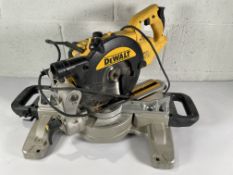 A pre-owned DEWALT DWS773-GB 216mm electric single-bevel sliding compound mitre saw.