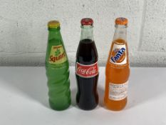 Eighty two bottles of assorted fizzy drinks to include Fanta, Coca Cola, Squirt (355ml bottles) (clo