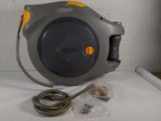 Pre-owned Hozelock 2595 Autoreel 40m 131ft outdoor garden hose with 3-in-1 nozzle and wall fittings.