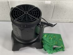 A Wacky inflatable man with fan blower.