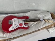 A boxed as new Squier Mini Stratocaster 3/4 size, Dakota Red (SN: ICSD25021624).